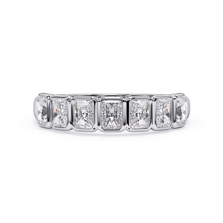 A picture of a seven stone diamond wedding ring with radiant cut diamonds that are bezel set in white gold or platinum on a white background with the ring facing forward, lying down.