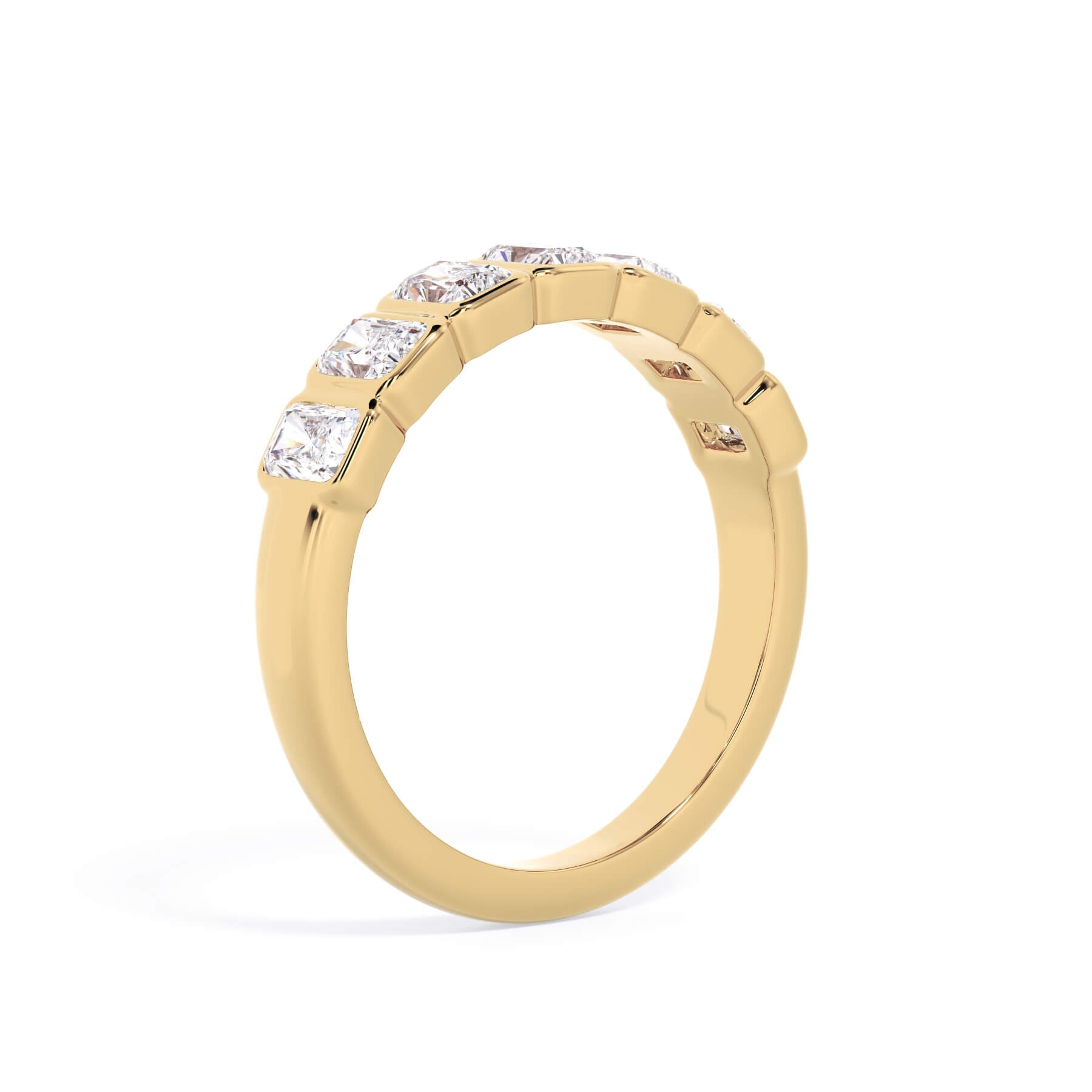 A picture of a seven stone diamond wedding ring with radiant cut diamonds that are bezel set in yellow gold on a white background with the ring facing forward, lying down.