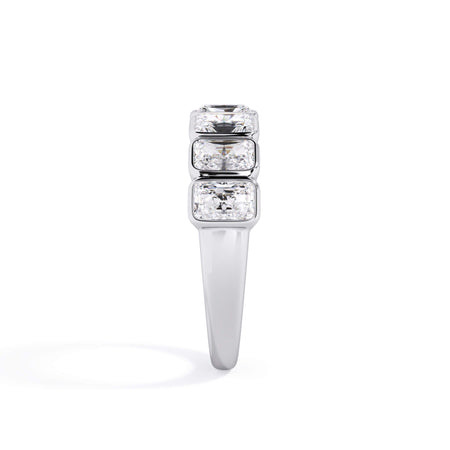 A picture of a seven stone diamond wedding ring with radiant cut diamonds that are bezel set in white gold or platinum on a white background with a side profile view.