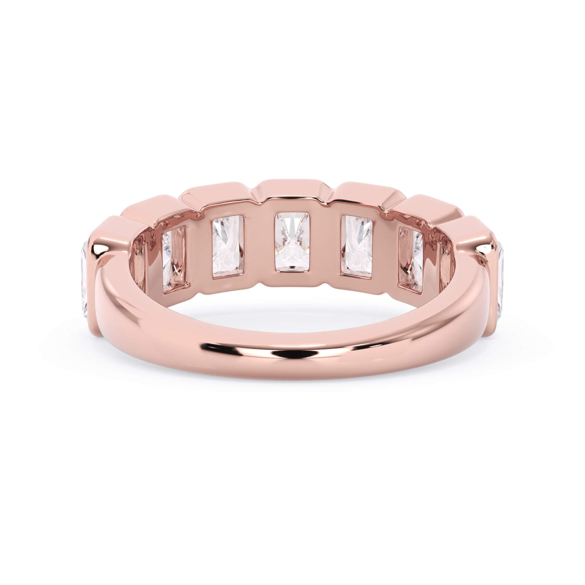 A picture of a seven stone diamond wedding ring with radiant cut diamonds that are bezel set in rose gold on a white background with a view of the underside of the ring.