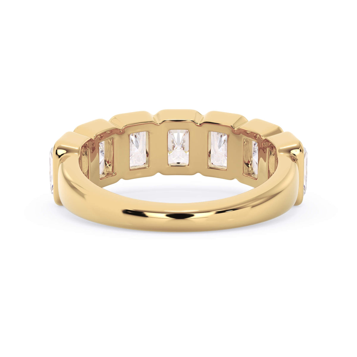 A picture of a seven stone diamond wedding ring with radiant cut diamonds that are bezel set in yellow gold on a white background with a view of the underside of the ring.