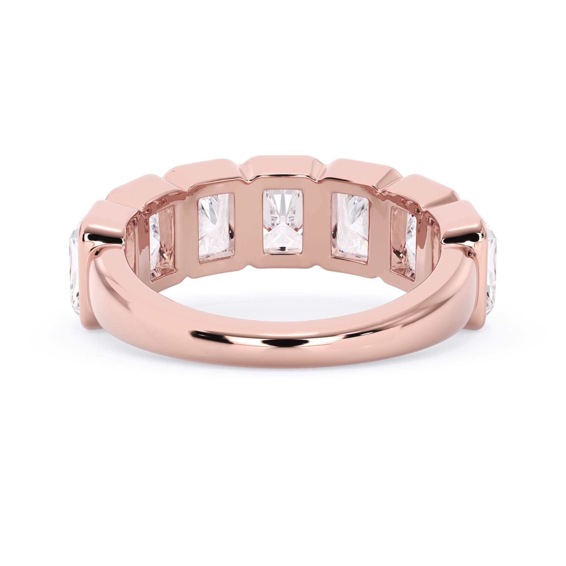 A picture of a seven stone diamond wedding ring with radiant cut diamonds that are bezel set in rose gold on a white background with a view of the underside of the ring.