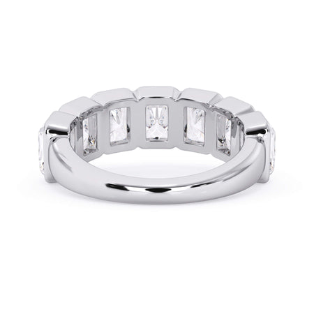 A picture of a seven stone diamond wedding ring with radiant cut diamonds that are bezel set in white gold or platinum on a white background with a view of the underside of the ring.