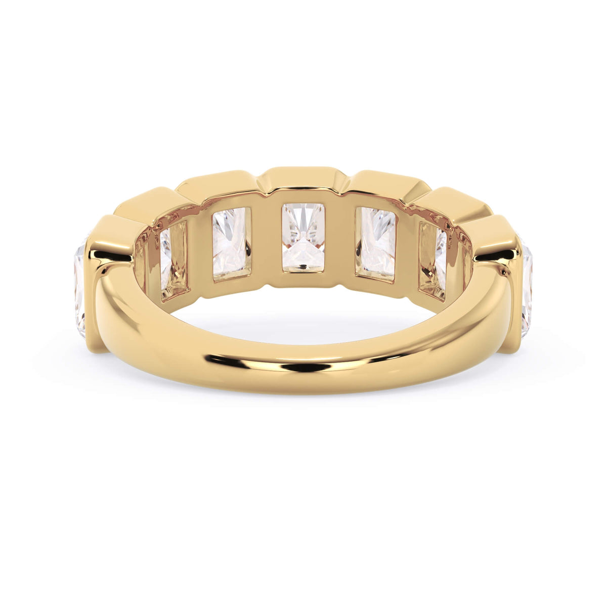 A picture of a seven stone diamond wedding ring with radiant cut diamonds that are bezel set in yellow gold on a white background with a view of the underside of the ring.