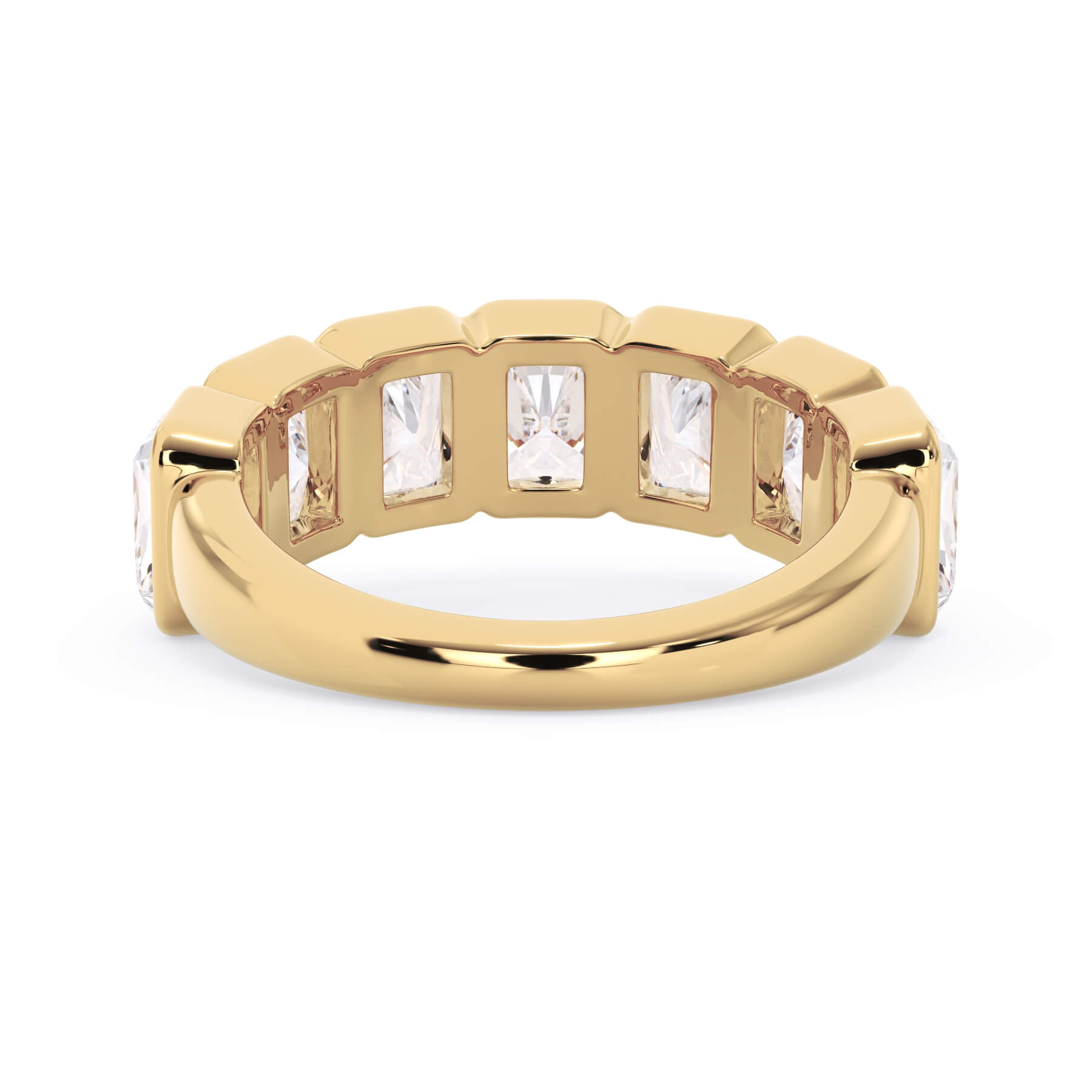 A picture of a seven stone diamond wedding ring with radiant cut diamonds that are bezel set in yellow gold on a white background with a view of the underside of the ring.