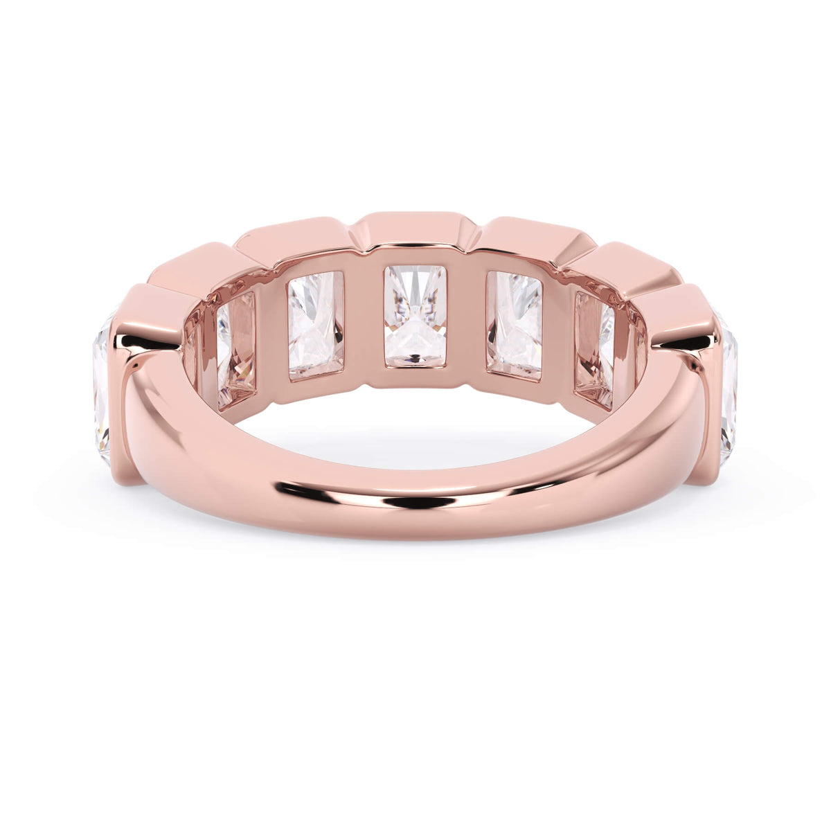 A picture of a seven stone diamond wedding ring with radiant cut diamonds that are bezel set in rose gold on a white background with a view of the underside of the ring.