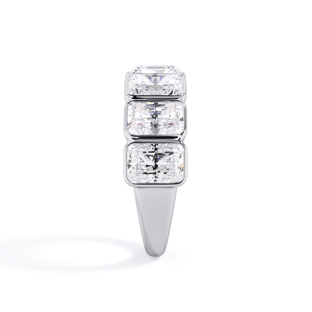 A picture of a seven stone diamond wedding ring with radiant cut diamonds that are bezel set in white gold or platinum on a white background with a side profile view.