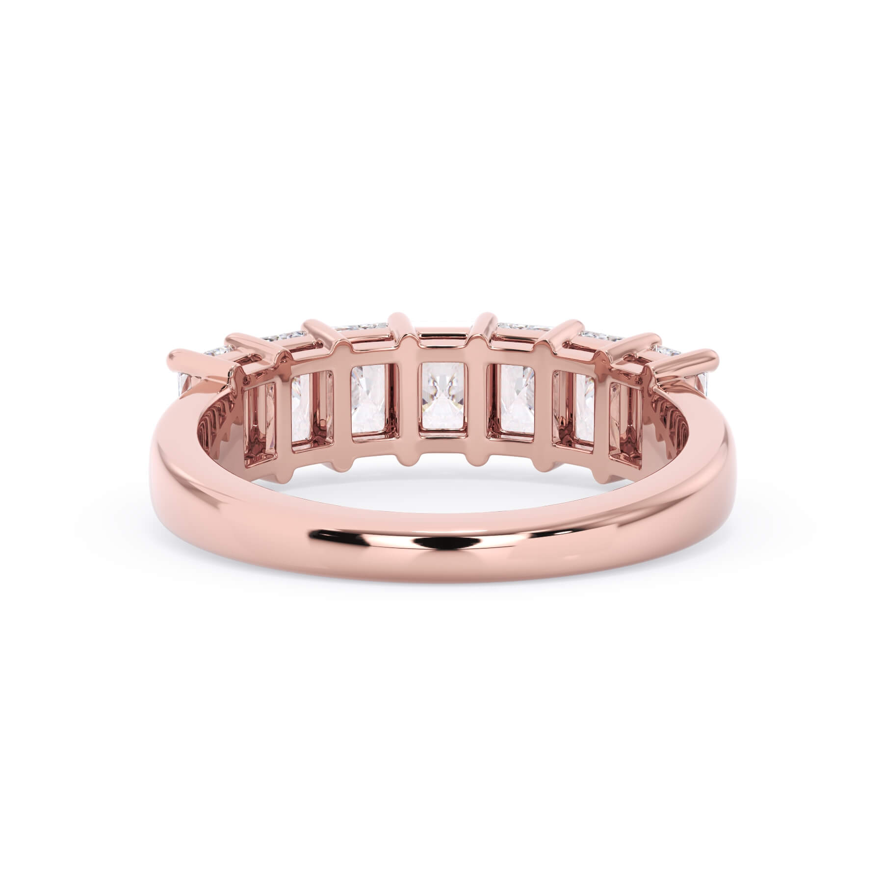 A picture of a seven stone diamond wedding ring with radiant cut diamonds that are shared prong set in rose gold on a white background with a view of the underside of the ring.