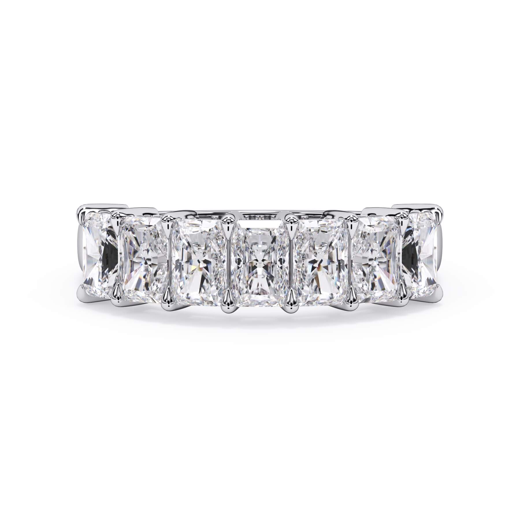 A picture of a seven stone diamond wedding ring with radiant cut diamonds that are shared prong set in white gold or platinum on a white background with the ring facing forward, lying down.