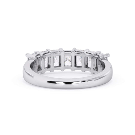 A picture of a seven stone diamond wedding ring with radiant cut diamonds that are shared prong set in white gold or platinum on a white background with a view of the underside of the ring.