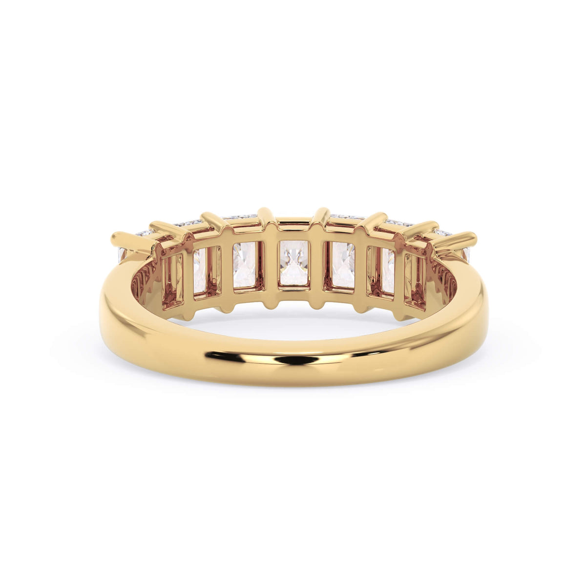 A picture of a seven stone diamond wedding ring with radiant cut diamonds that are shared prong set in yellow gold on a white background with a view of the underside of the ring.