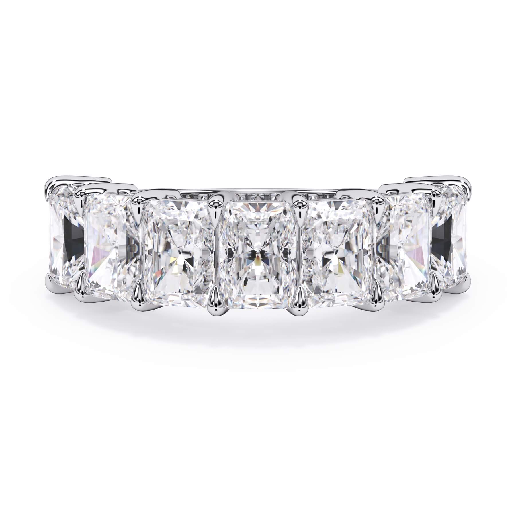 A picture of a seven stone diamond wedding ring with radiant cut diamonds that are shared prong set in white gold or platinum on a white background with the ring facing forward, lying down.