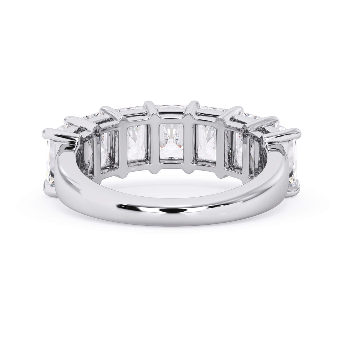 A picture of a seven stone diamond wedding ring with radiant cut diamonds that are shared prong set in white gold or platinum on a white background with a view of the underside of the ring.
