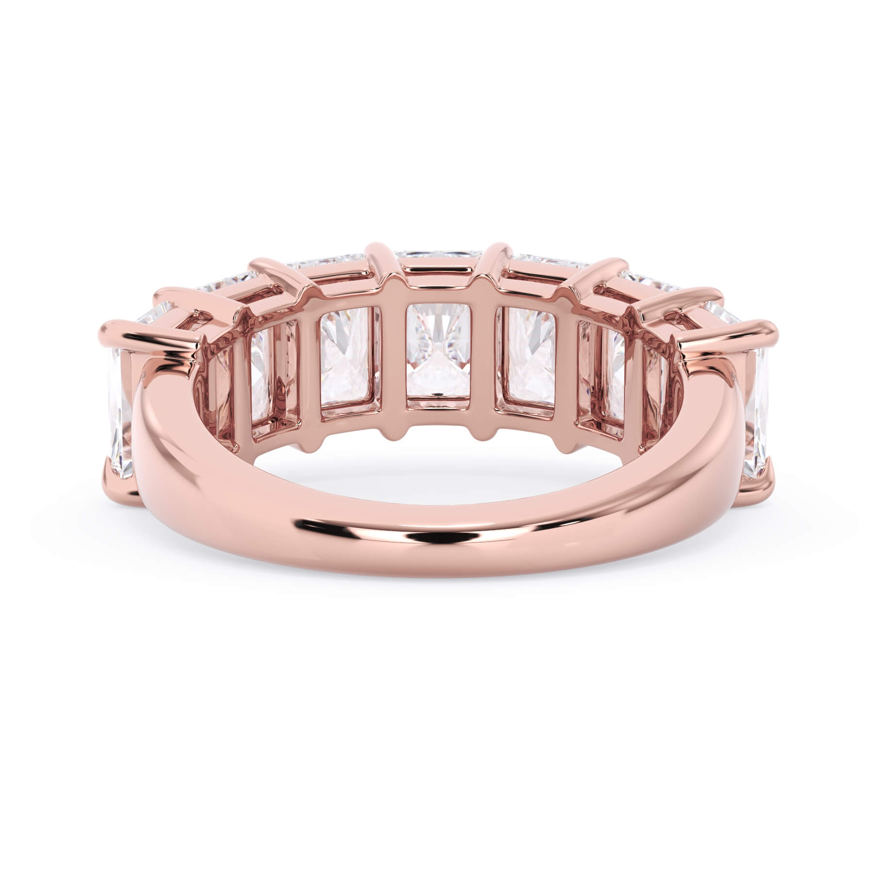 A picture of a seven stone diamond wedding ring with radiant cut diamonds that are shared prong set in rose gold on a white background with a view of the underside of the ring.