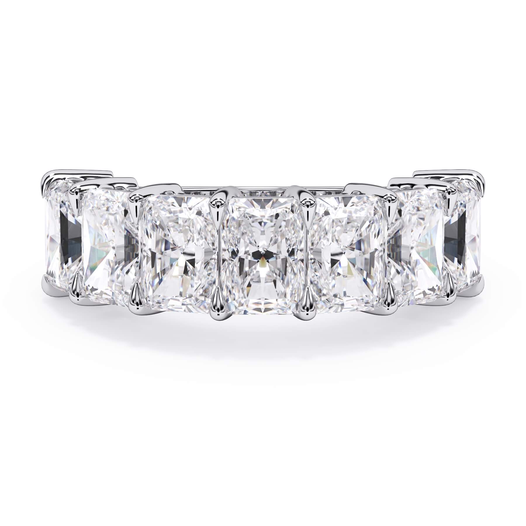 A picture of a seven stone diamond wedding ring with radiant cut diamonds that are shared prong set in white gold or platinum on a white background with the ring facing forward, lying down.