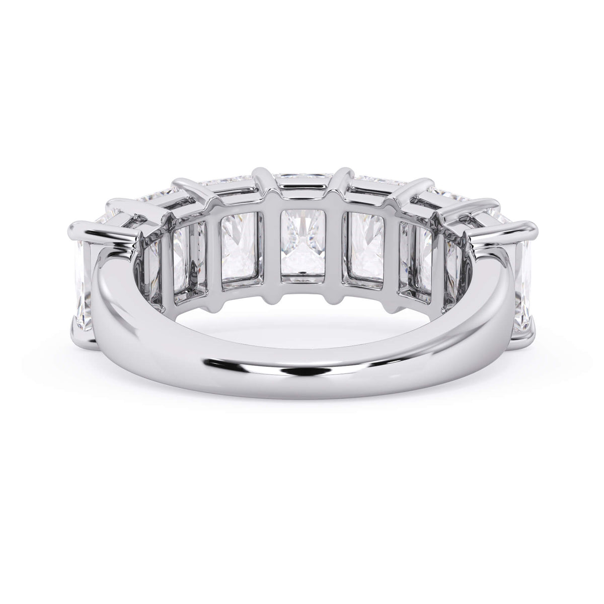 A picture of a seven stone diamond wedding ring with radiant cut diamonds that are shared prong set in white gold or platinum on a white background with a view of the underside of the ring.