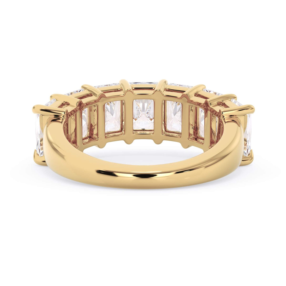 A picture of a seven stone diamond wedding ring with radiant cut diamonds that are shared prong set in yellow gold on a white background with a view of the underside of the ring.
