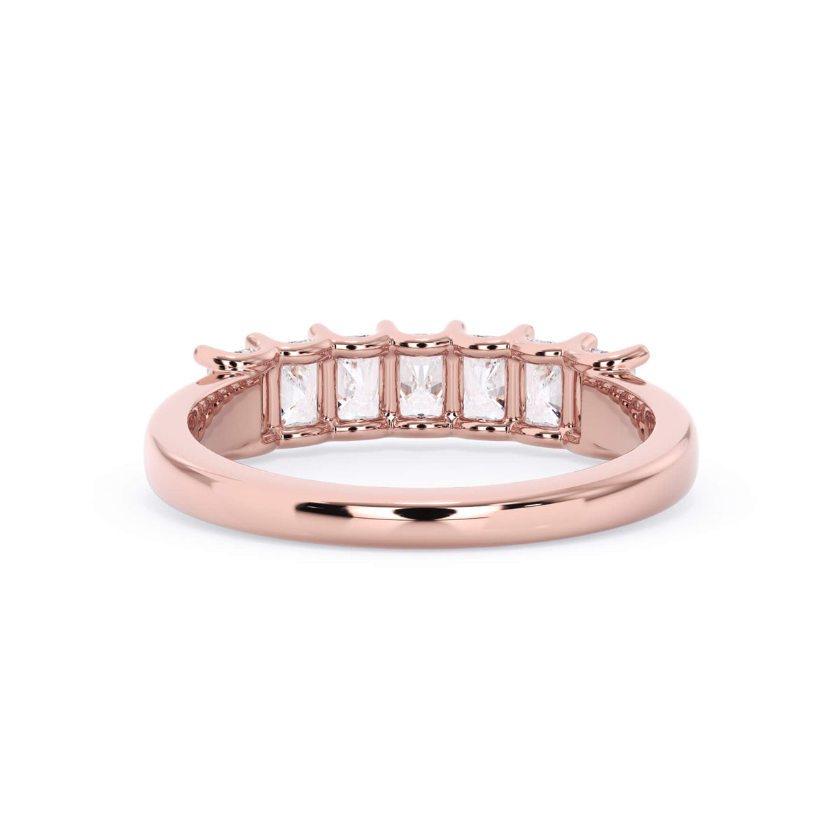 A picture of a seven stone diamond wedding ring with radiant cut diamonds that are U prong set in rose gold on a white background with a view of the underside of the ring.