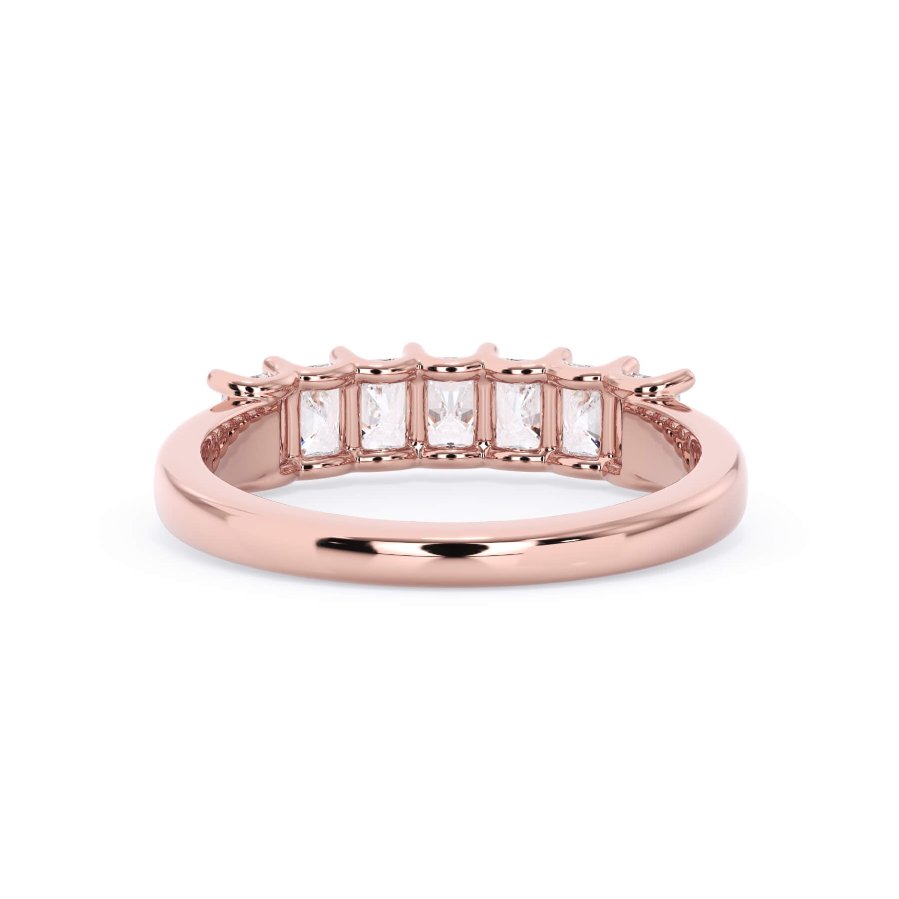 A picture of a seven stone diamond wedding ring with radiant cut diamonds that are U prong set in rose gold on a white background with a view of the underside of the ring.