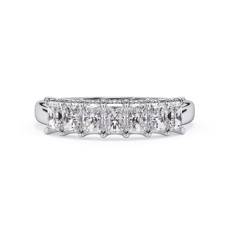 A picture of a seven stone diamond wedding ring with radiant cut diamonds that are U prong set in white gold or platinum on a white background with the ring facing forward, lying down.