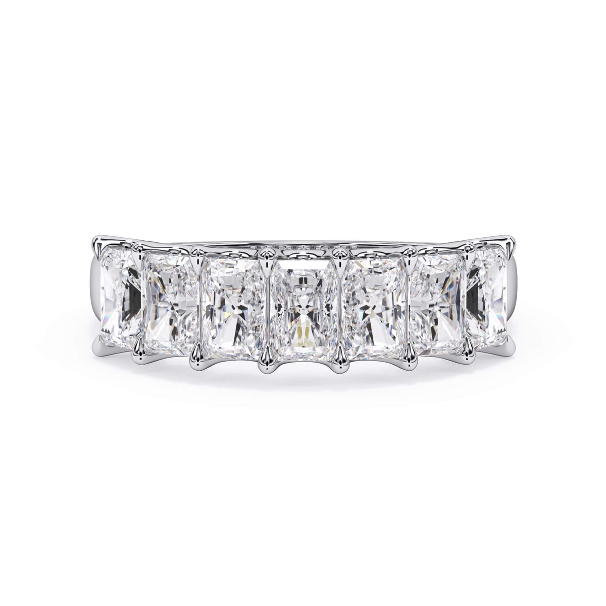 A picture of a seven stone diamond wedding ring with radiant cut diamonds that are U prong set in white gold or platinum on a white background with the ring facing forward, lying down.