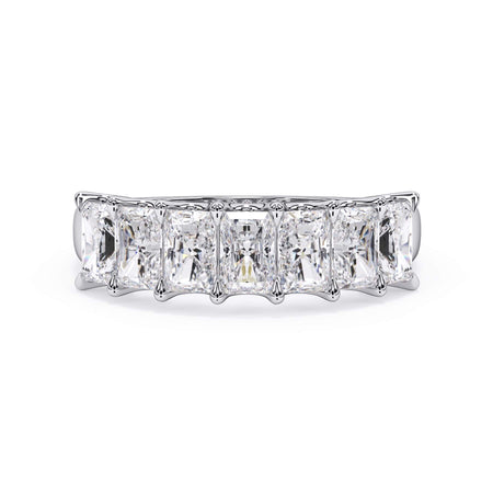 A picture of a seven stone diamond wedding ring with radiant cut diamonds that are U prong set in white gold or platinum on a white background with the ring facing forward, lying down.