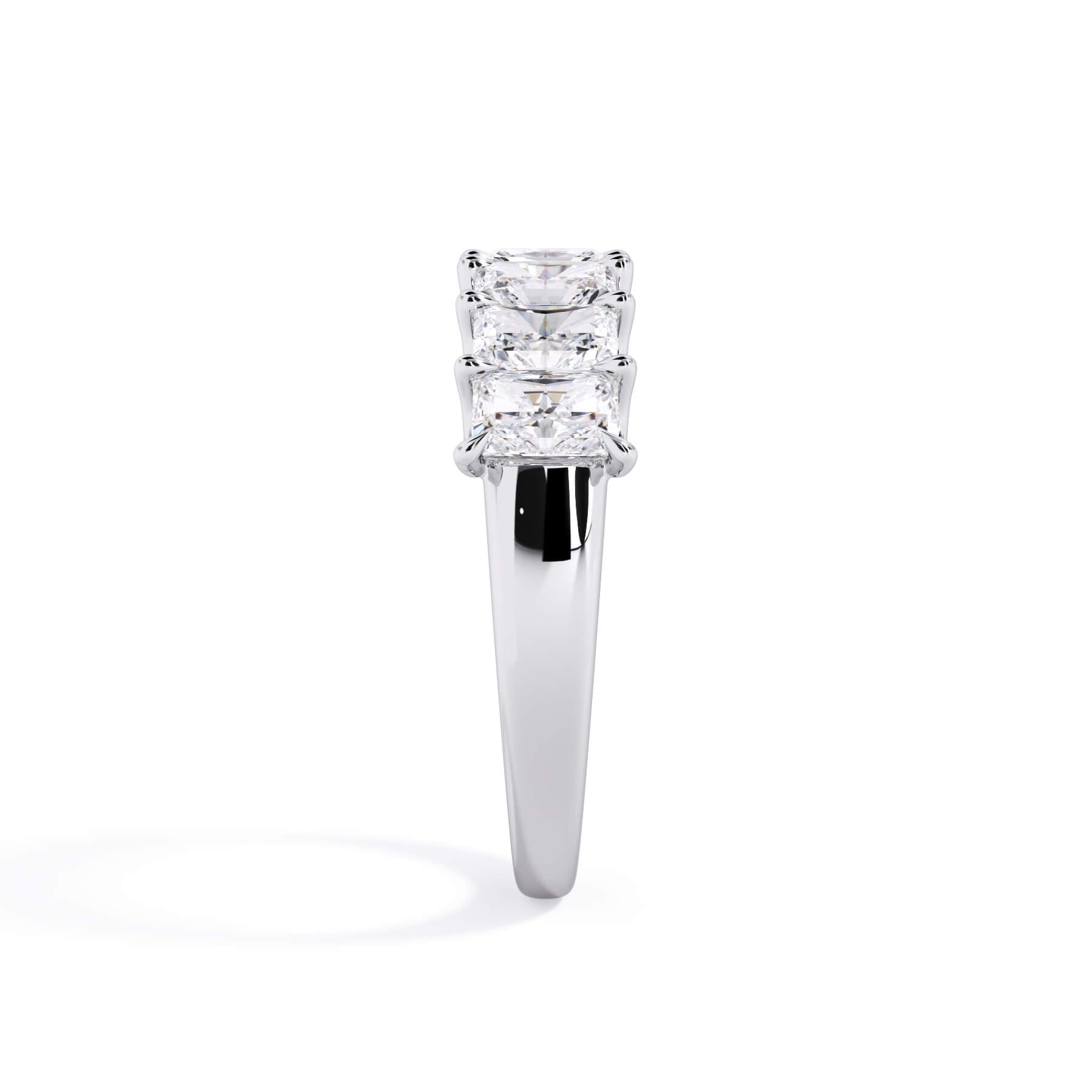 A picture of a seven stone diamond wedding ring with radiant cut diamonds that are U prong set in white gold or platinum on a white background with a side profile view.