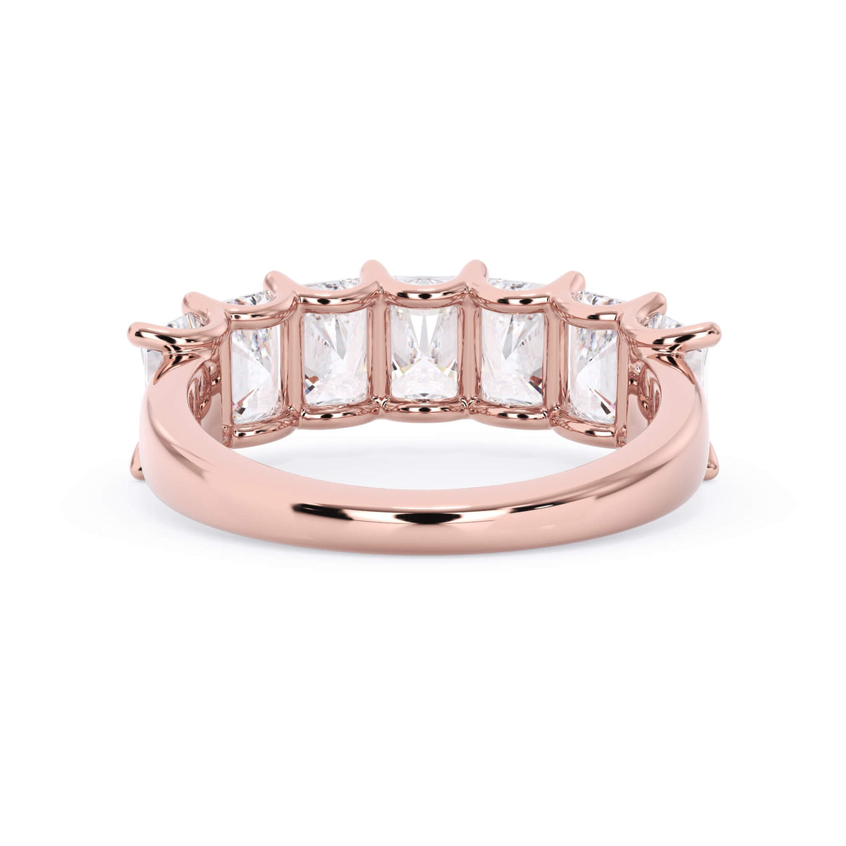 A picture of a seven stone diamond wedding ring with radiant cut diamonds that are U prong set in rose gold on a white background with a view of the underside of the ring.