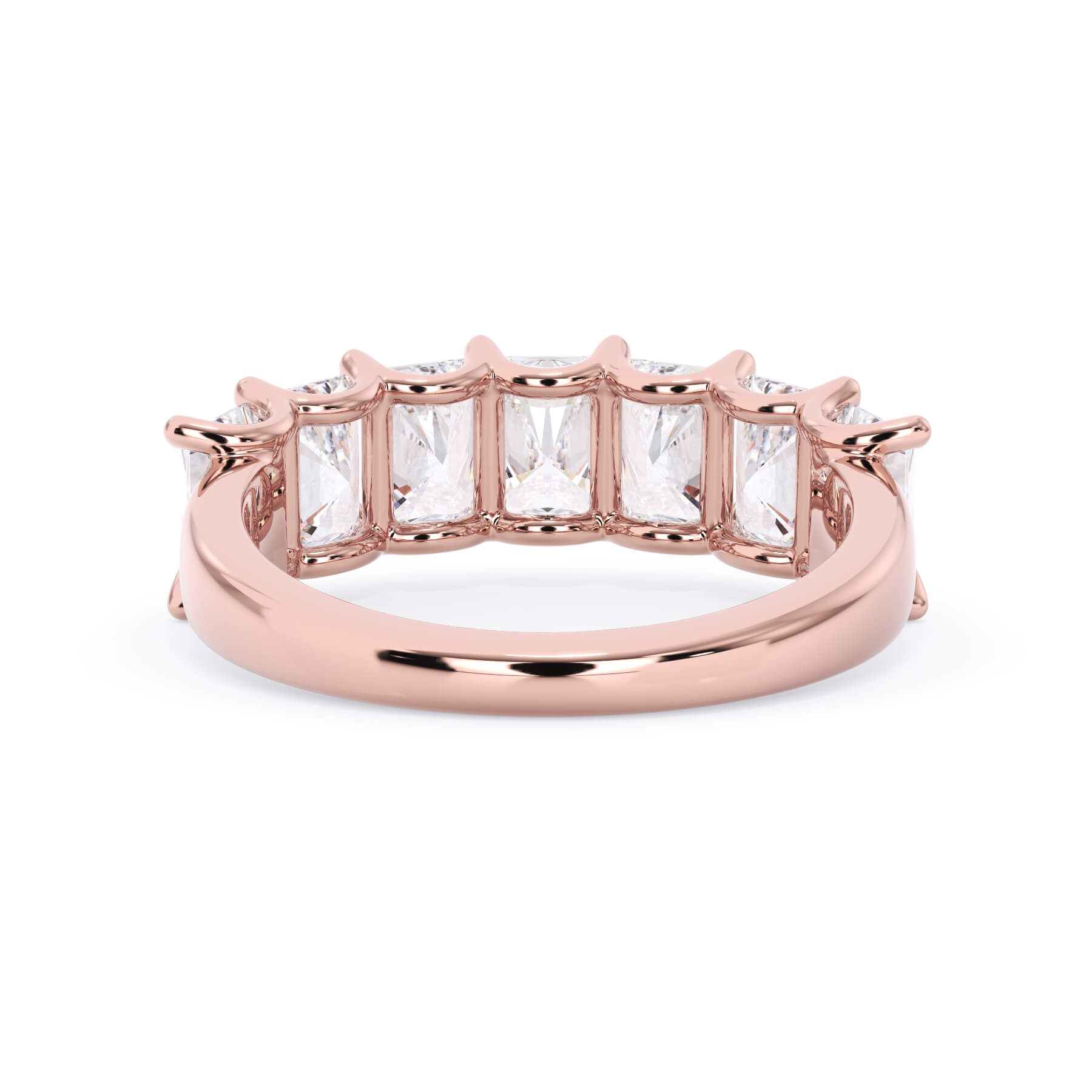 A picture of a seven stone diamond wedding ring with radiant cut diamonds that are U prong set in rose gold on a white background with a view of the underside of the ring.