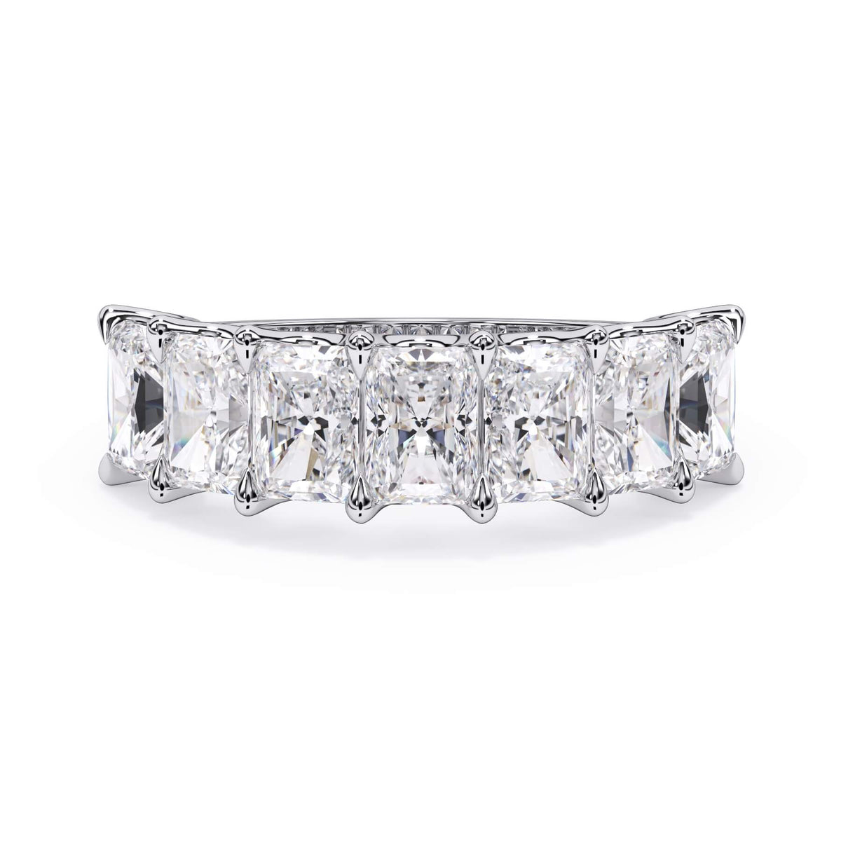 A picture of a seven stone diamond wedding ring with radiant cut diamonds that are U prong set in white gold or platinum on a white background with the ring facing forward, lying down.