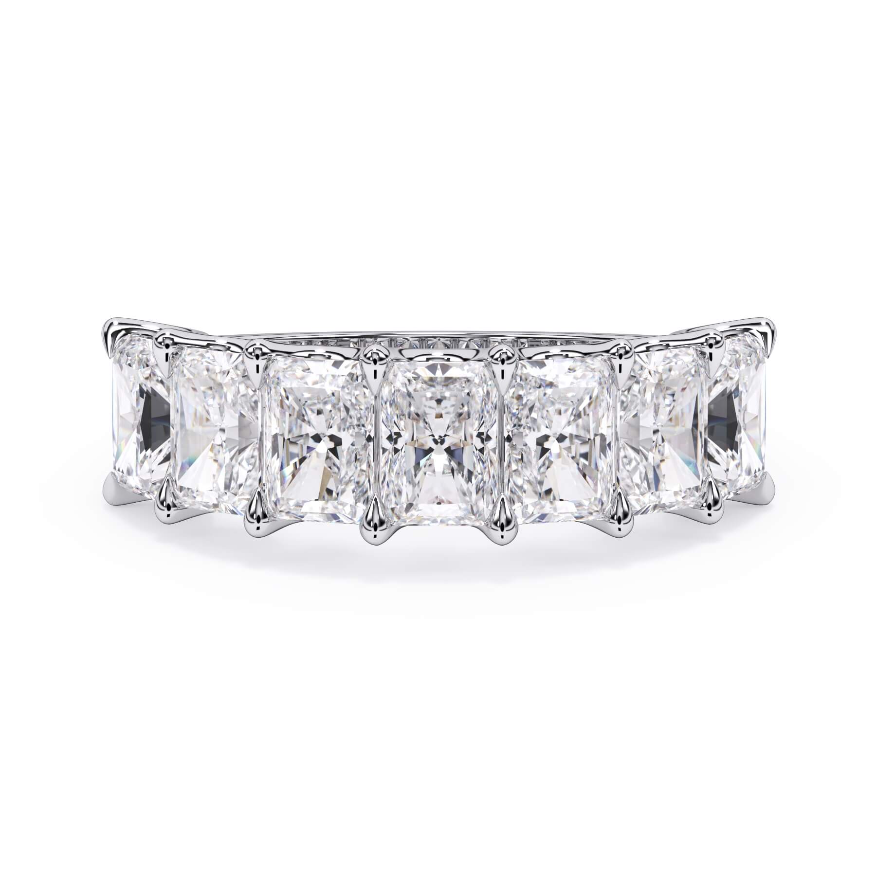 A picture of a seven stone diamond wedding ring with radiant cut diamonds that are U prong set in white gold or platinum on a white background with the ring facing forward, lying down.