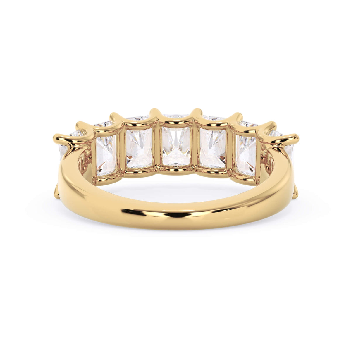 A picture of a seven stone diamond wedding ring with radiant cut diamonds that are U prong set in yellow gold on a white background with a view of the underside of the ring.