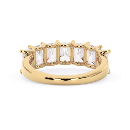 A picture of a seven stone diamond wedding ring with radiant cut diamonds that are U prong set in yellow gold on a white background with a view of the underside of the ring.