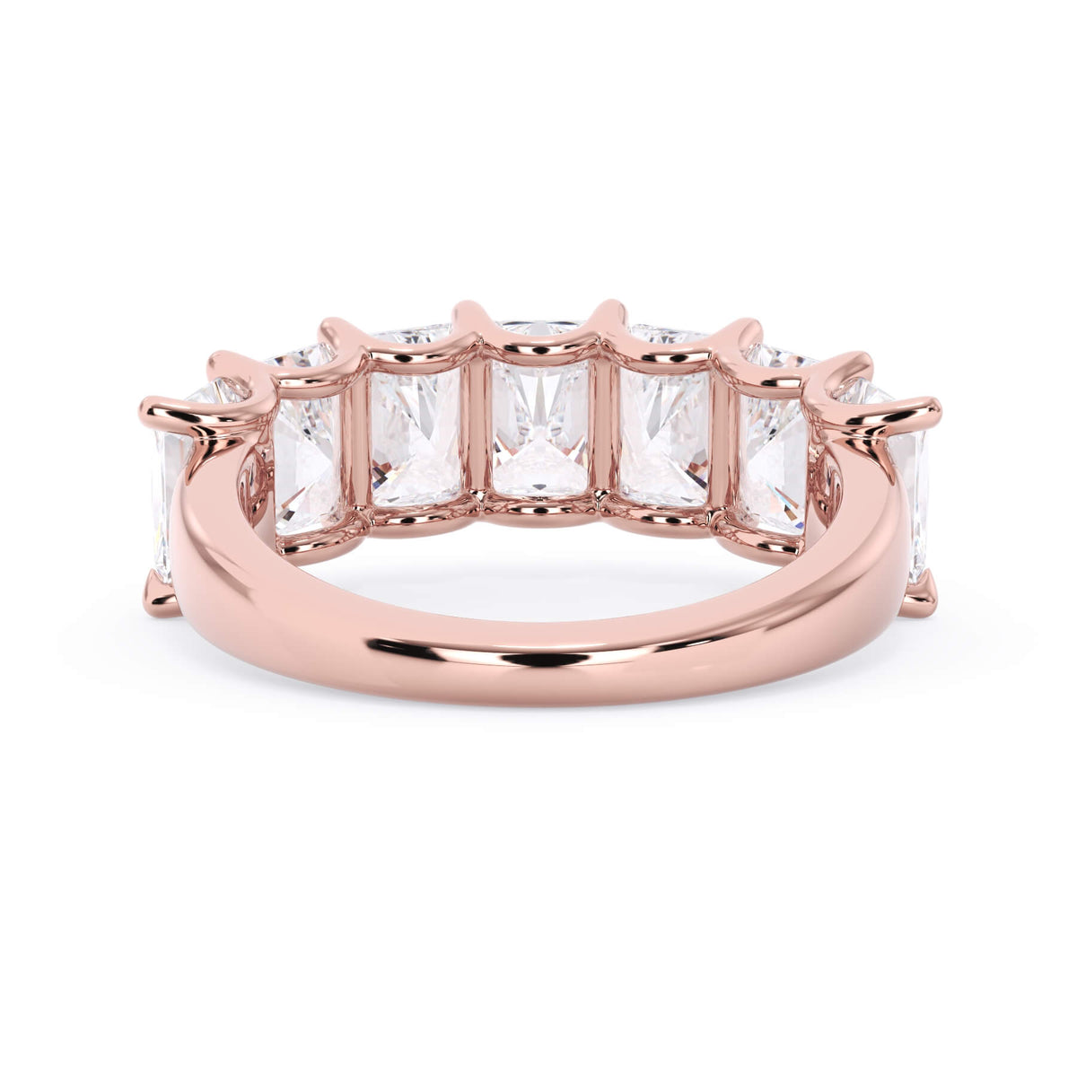 A picture of a seven stone diamond wedding ring with radiant cut diamonds that are U prong set in rose gold on a white background with the ring facing forward, lying down.