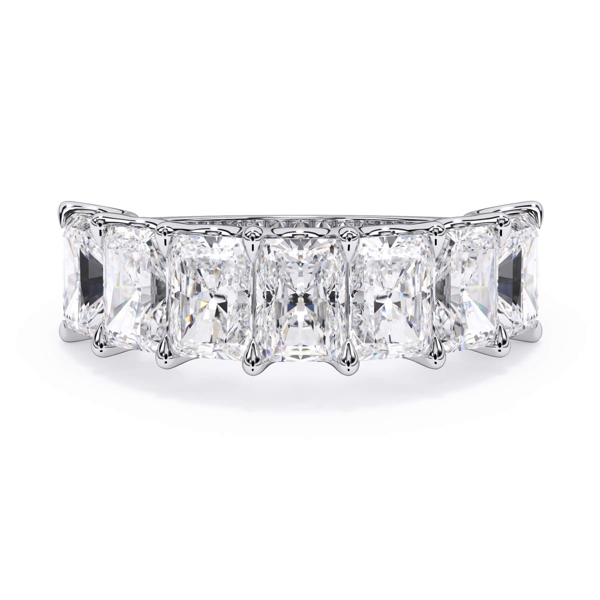 A picture of a seven stone diamond wedding ring with radiant cut diamonds that are U prong set in white gold or platinum on a white background with the ring facing forward, lying down.