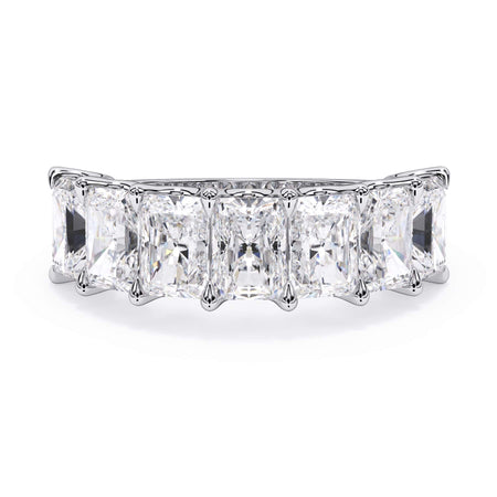 A picture of a seven stone diamond wedding ring with radiant cut diamonds that are U prong set in white gold or platinum on a white background with the ring facing forward, lying down.