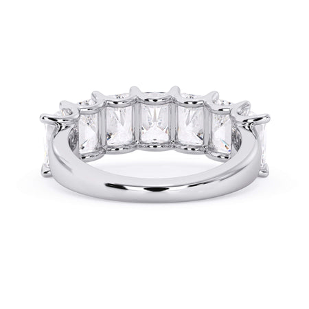 A picture of a seven stone diamond wedding ring with radiant cut diamonds that are U prong set in white gold or platinum on a white background with the ring facing forward, lying down.