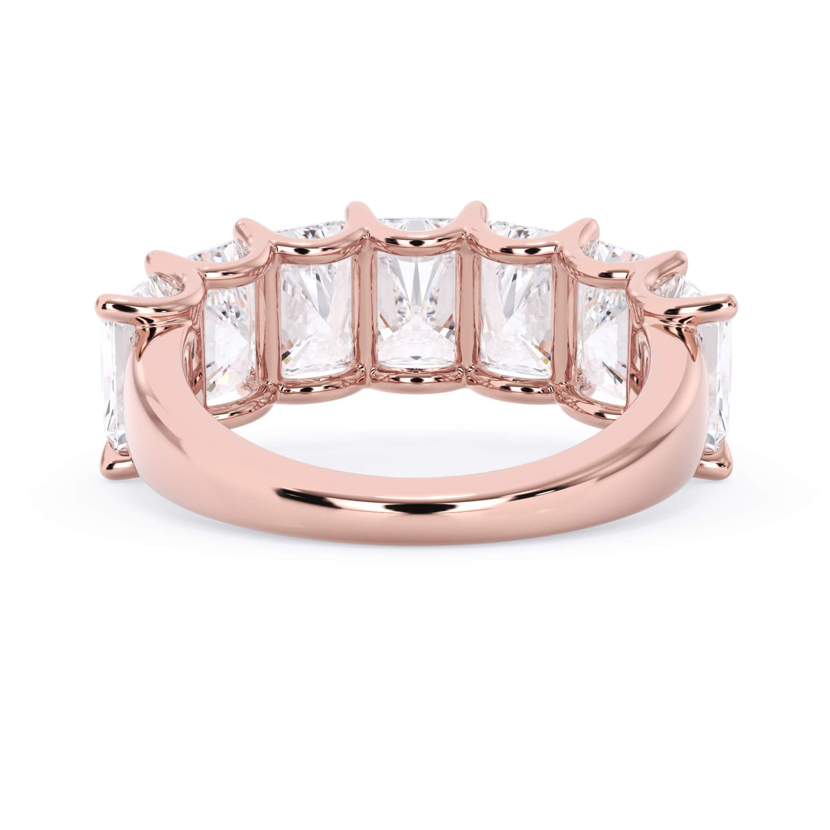 A picture of a seven stone diamond wedding ring with radiant cut diamonds that are U prong set in rose gold on a white background with a view of the underside of the ring.
