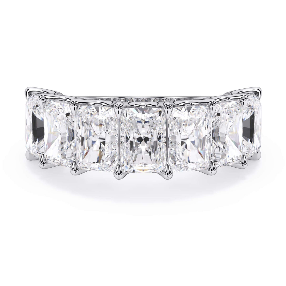 A picture of a seven stone diamond wedding ring with radiant cut diamonds that are U prong set in white gold or platinum on a white background with the ring facing forward, lying down.