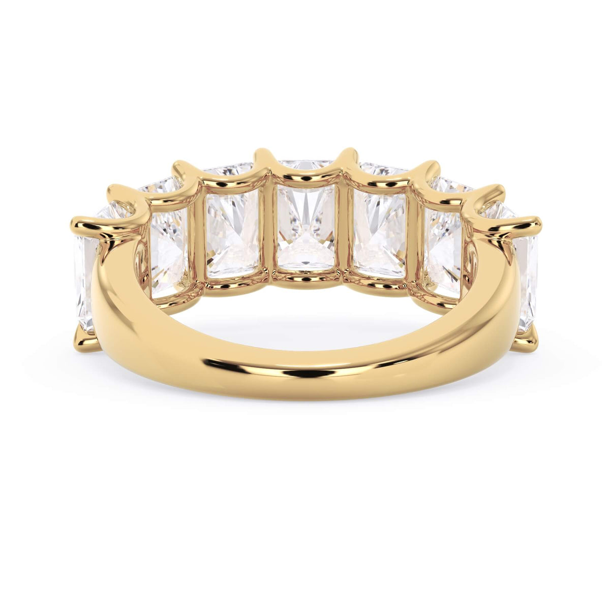 A picture of a seven stone diamond wedding ring with radiant cut diamonds that are U prong set in yellow gold on a white background with a view of the underside of the ring.