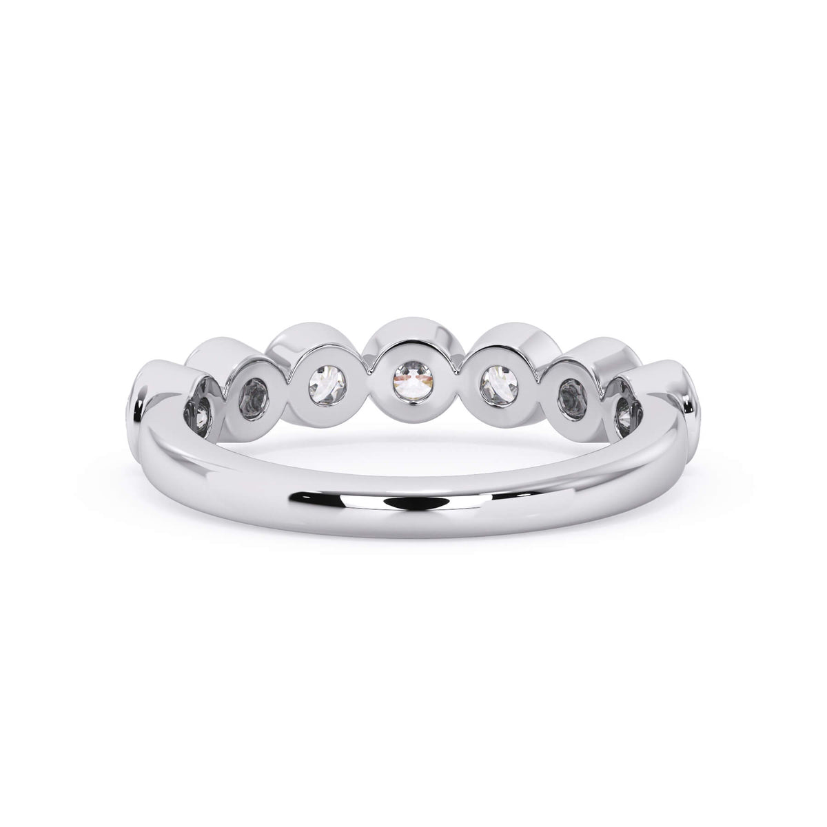 A picture of a seven stone diamond wedding ring with round diamonds that are bezel set in white gold or platinum on a white background with a view of the underside of the ring.