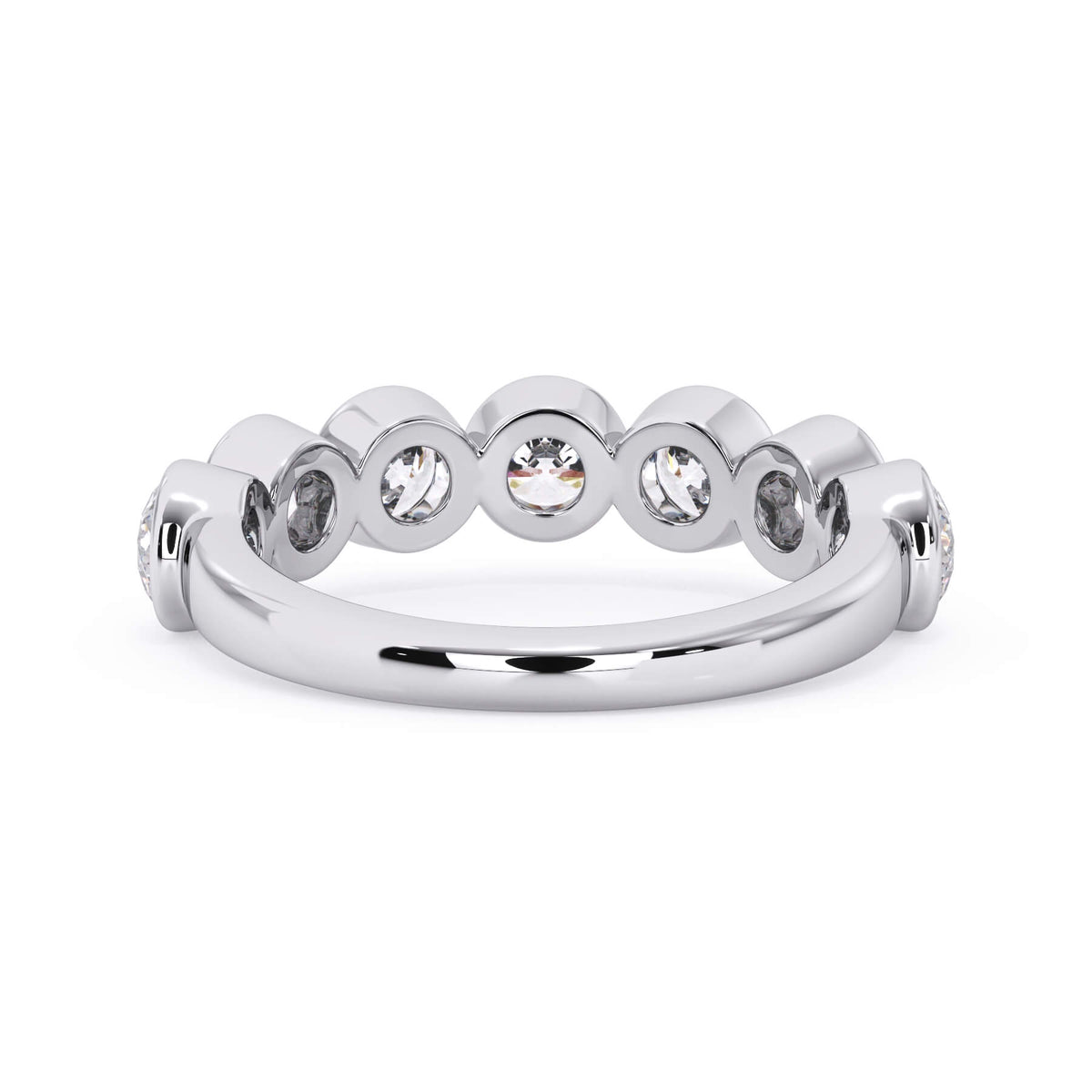 A picture of a seven stone diamond wedding ring with round diamonds that are bezel set in white gold or platinum on a white background with a view of the underside of the ring.