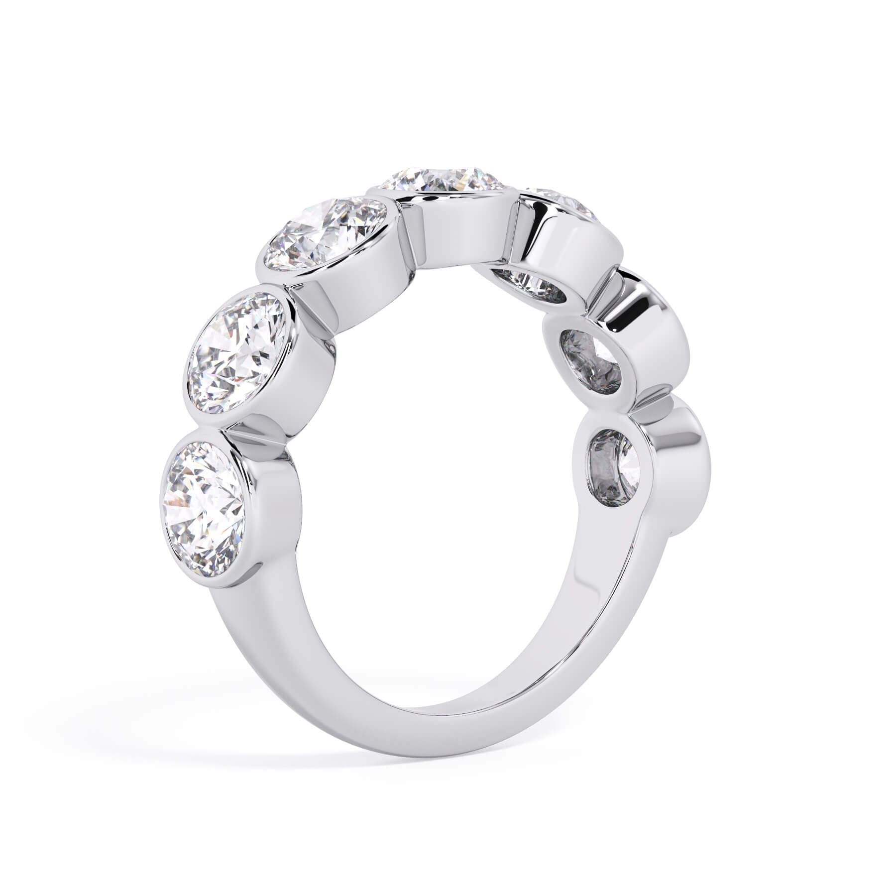 A picture of a seven stone diamond wedding ring with round diamonds that are bezel set in white gold or platinum on a white background with a slightly angled, through the finger view.