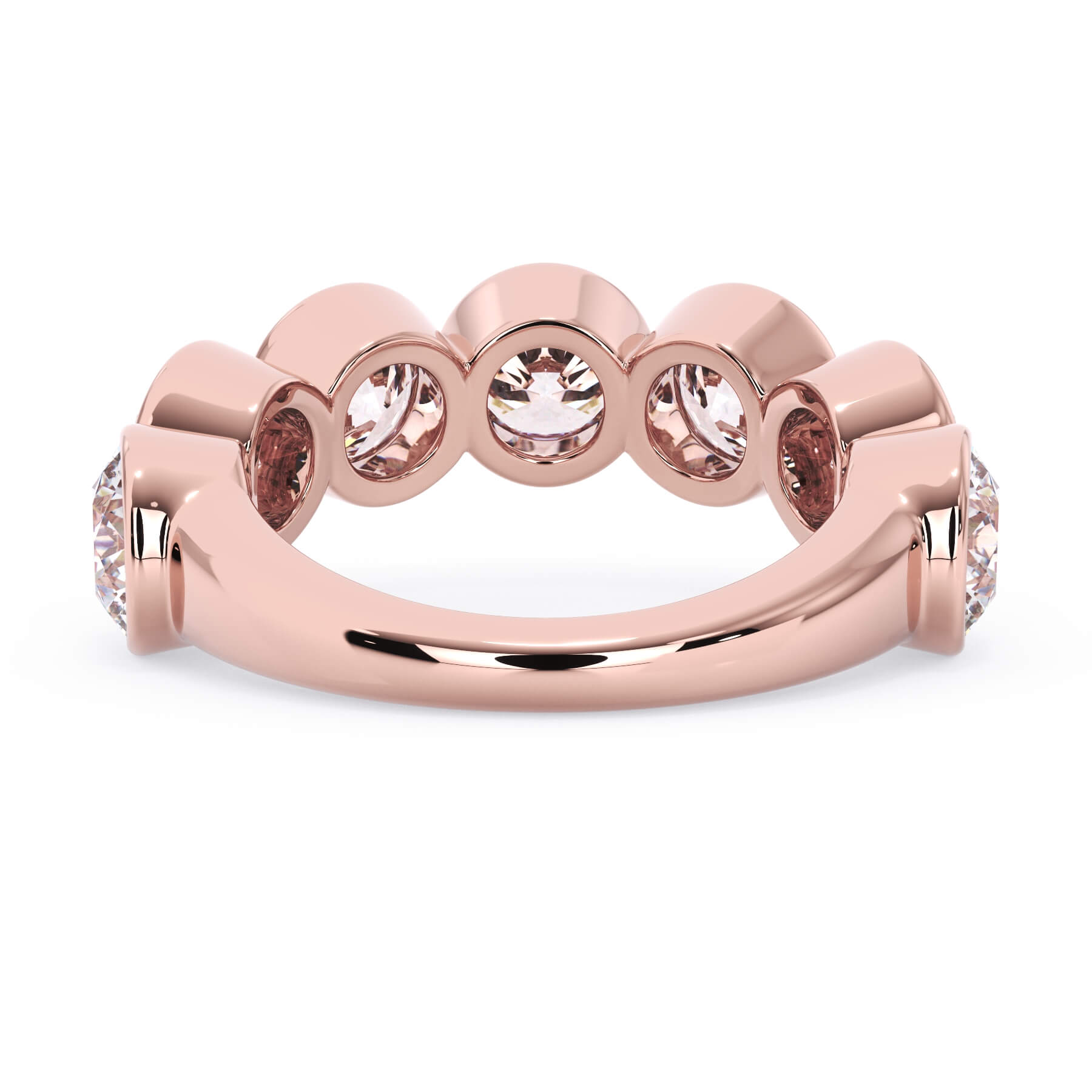 A picture of a seven stone diamond wedding ring with round diamonds that are bezel set in rose gold on a white background with a view of the underside of the ring.