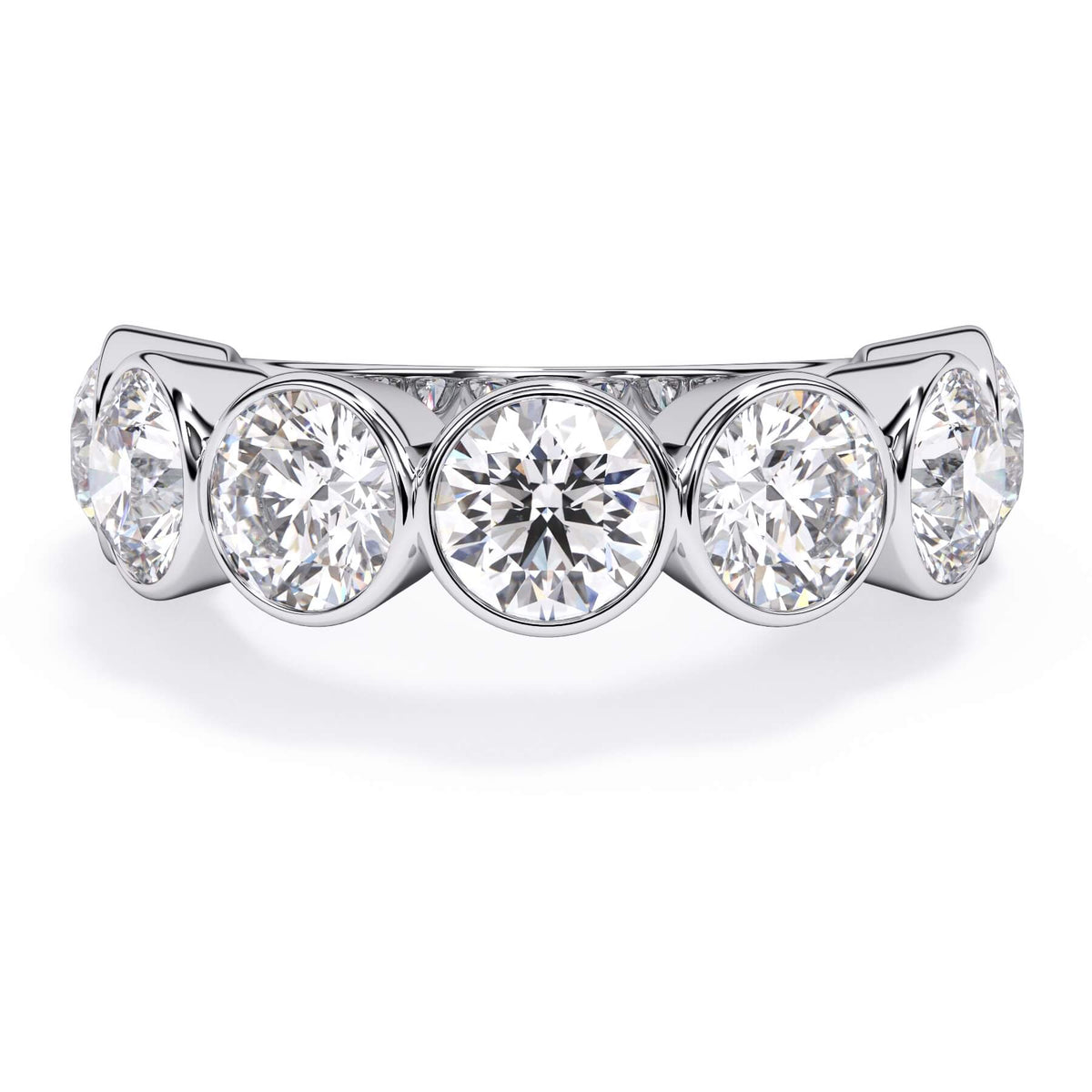 A picture of a seven stone diamond wedding ring with round diamonds that are bezel set in white gold or platinum on a white background with the ring facing forward, lying down.