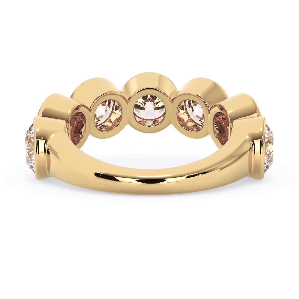 A picture of a seven stone diamond wedding ring with round diamonds that are bezel set in yellow gold on a white background with a view of the underside of the ring.