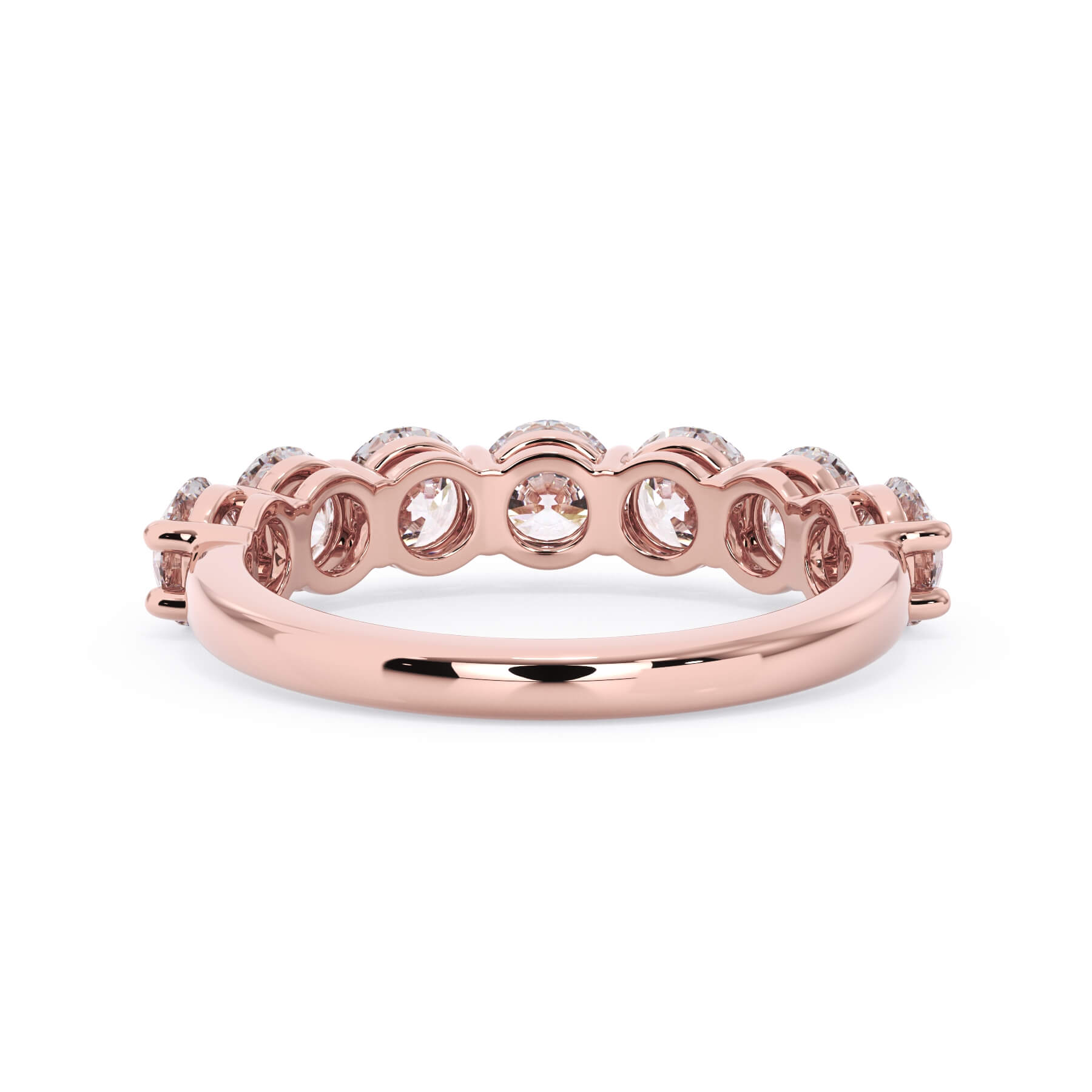 A picture of a seven stone diamond wedding ring with round diamonds that are shared prong set in rose gold on a white background with a view of the underside of the ring.