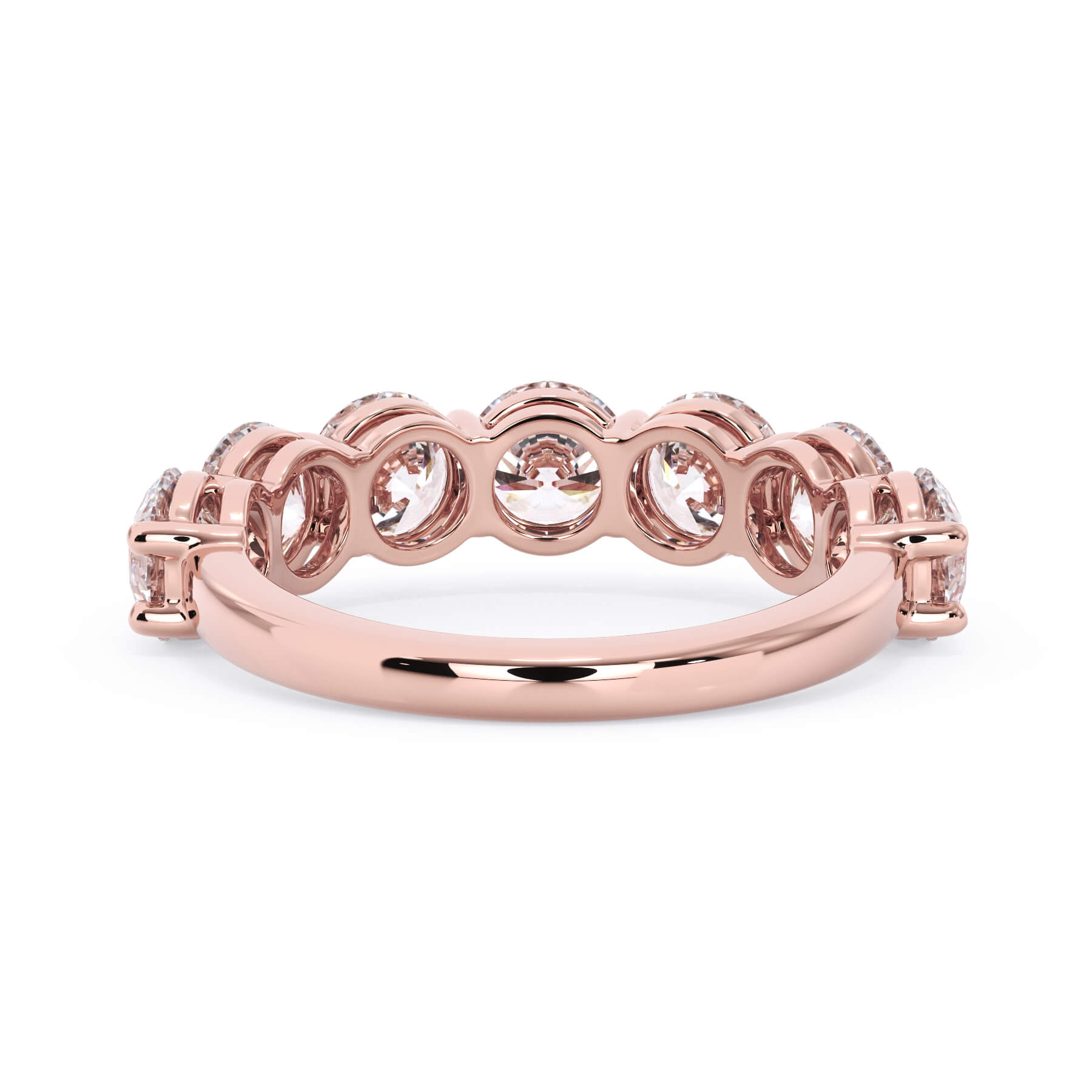 A picture of a seven stone diamond wedding ring with round diamonds that are shared prong set in rose gold on a white background with a view of the underside of the ring.