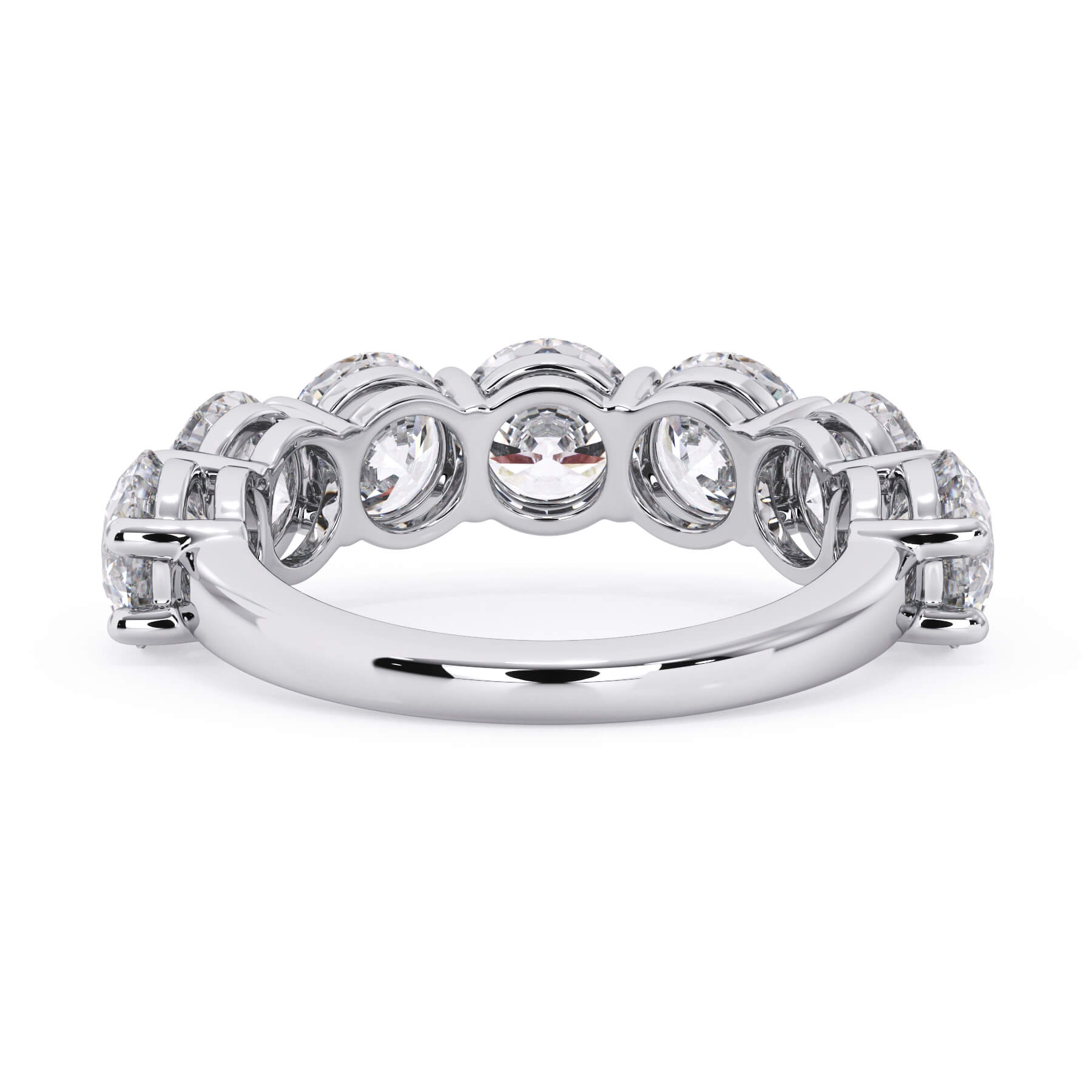 A picture of a seven stone diamond wedding ring with round diamonds that are shared prong set in white gold or platinum on a white background with a view of the underside of the ring.
