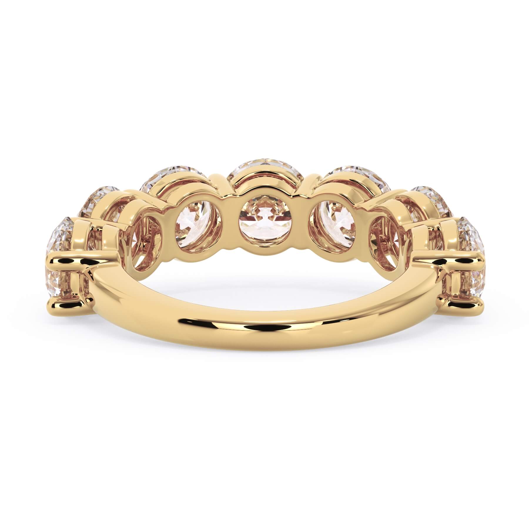 A picture of a seven stone diamond wedding ring with round diamonds that are shared prong set in yellow gold on a white background with a view of the underside of the ring.